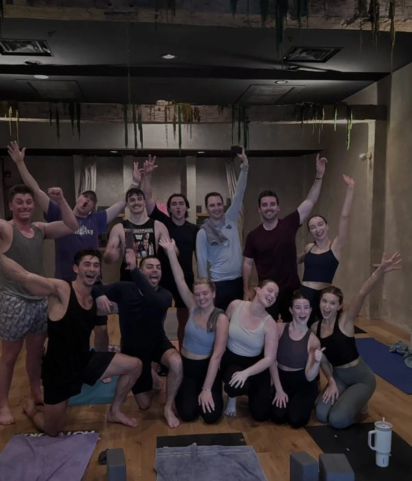 The Brooksource group together on yoga mats at REWILD YOGA.
